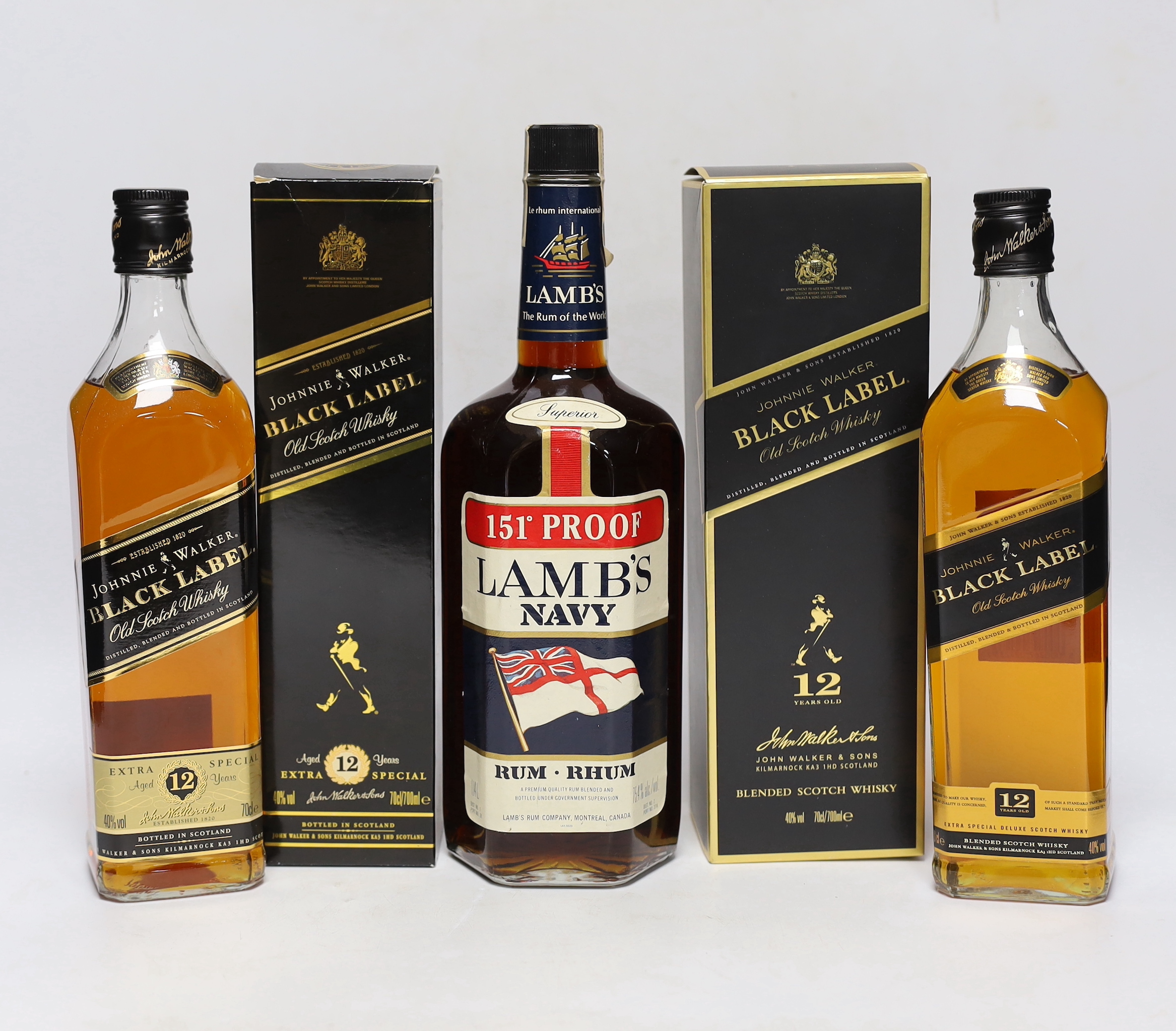 A Lamb's 151 proof 1960's bottle of Navy rhum and two bottles of Johnnie Walker black label whisky